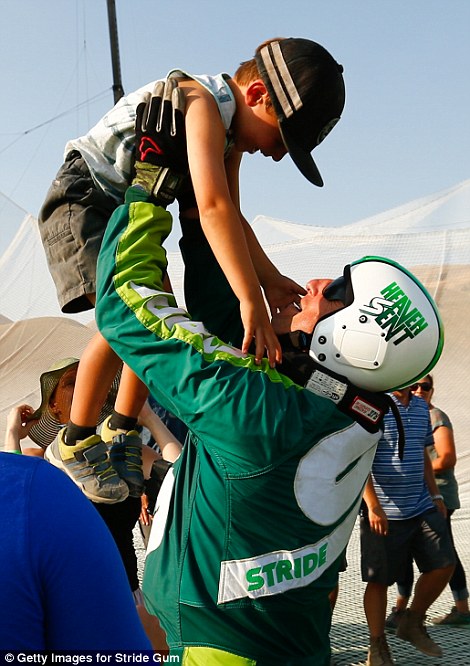 36BCF44A00000578-3716528-Aikins_celebrates_with_son_Logan_after_jumping_25_000_feet_from_-m-62_1469940658143